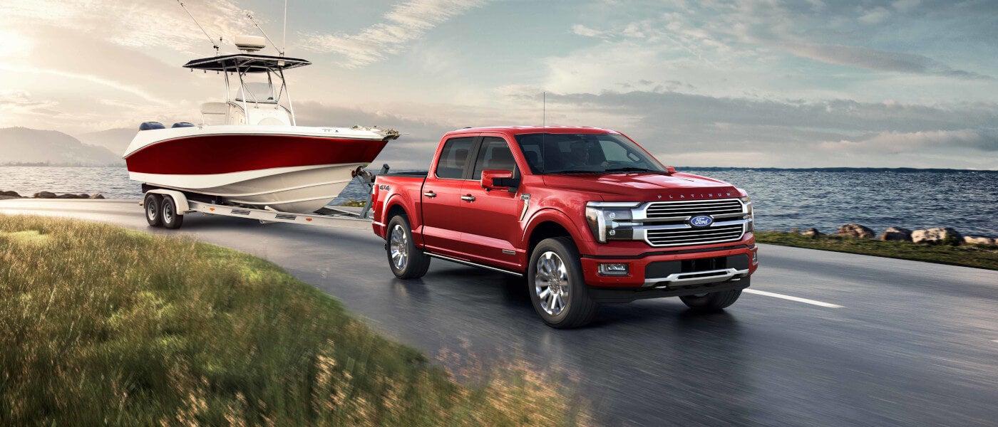2025 Ford F-150 Exterior Towing A Boat By Lake
